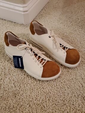 Birkenstock Men’s White/Cream Sneakers with Brown Suede Toe & Heel.